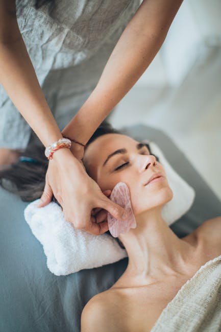 hands performing gentle circular massage movements around closed eyes demonstration
